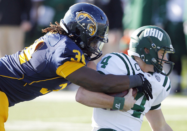 Kent State's Richard Gray sacks Ohio's Tyler Tettleton during the first quarter of an NCAA college football game, Friday, Nov. 23, 2012, in Kent, Ohio.  (AP Photo/Ron Schwane)