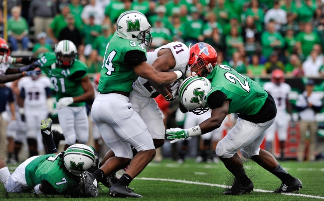 Oct 25, 2014; Huntington, WV, USA; Marshall Thundering Herd defensive back Rodney Allen (34) and linebacker D.J. Hunter (22) tackle Florida Atlantic Owls defensive back D'Joun Smith (21) on a kickoff return in the first quarter at Joan C. Edwards Stadium. Marshall defeated Florida Atlantic 35-16. Mandatory Credit: Michael Shroyer-USA TODAY Sports