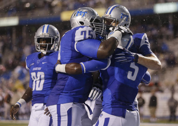 MTSU OL Darius Johnson (75) and RB Jeremiah Bryson (5) celebrate a TD (Photo Courtesy of Mark Humphrey/AP)