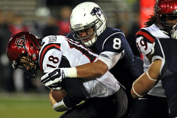 Nevada DL Ian Seau sacks SDSU QB Quinn Kaehler (Photo Courtesy of Lance Iversen/AP Photo)