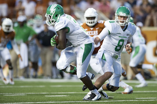 AUSTIN, TX - AUGUST 30:  Josh Greer #8 of the North Texas Mean Green hands the ball off to Reggie Pegram #2 against the Texas Longhorns during the first quarter on August 30, 2014 at Darrell K Royal-Texas Memorial Stadium in Austin, Texas.  (Photo by Cooper Neill/Getty Images)