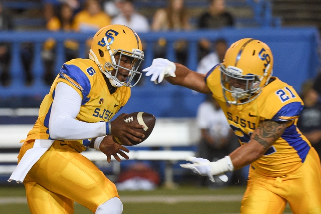 September 27, 2014; San Jose, CA, USA; San Jose State Spartans quarterback Joe Gray (6) hands off to running back Jarrod Lawson (21) before the game against the Nevada Wolf Pack at Spartan Stadium. Mandatory Credit: Kyle Terada-USA TODAY Sports