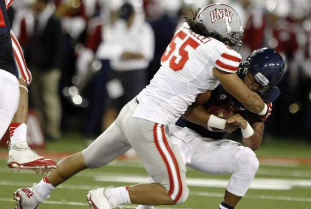UNLV LB Tau Lotulelei sacks Arizona QB Anu Solomon (Photo Courtesy of AP Photo/Rick Scuteri)