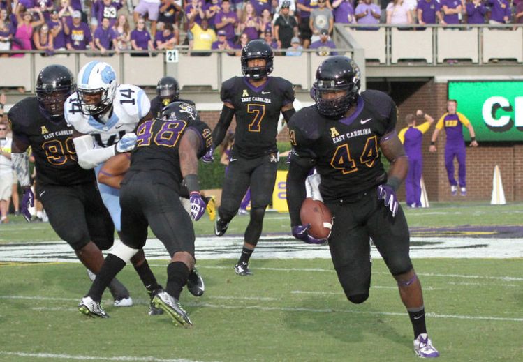 ECU LB Zeek Bigger returns an interception for a touchdown (Photo Courtesy of Mike Seegars)