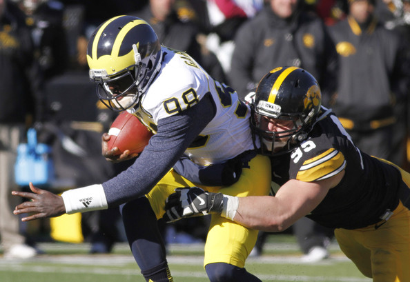 Iowa DE Drew Ott brings down Michigan QB Devin Gardner (Photo Courtesy of Matthew Hoist/Getty Images North America)