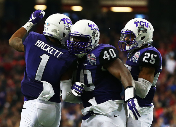 A group of TCU defenders celebrate an INT against Ole Miss (Photo Courtesy of Streeter Lecka/Getty Images North America)