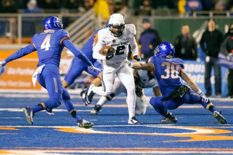 Utah State QB Kent Myers (Photo Courtesy of Otto Kitsinger/AP Photo)