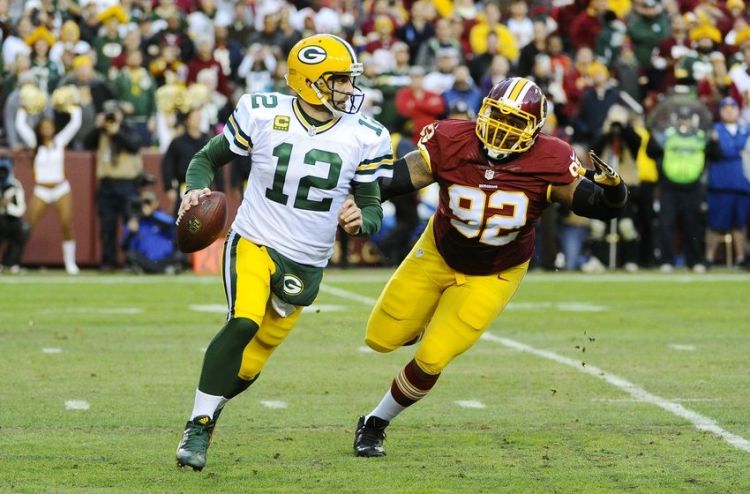 Aaron Rodgers rolls out against Washington (Photo Courtesy of Brad Mills/USA TODAY Sports)